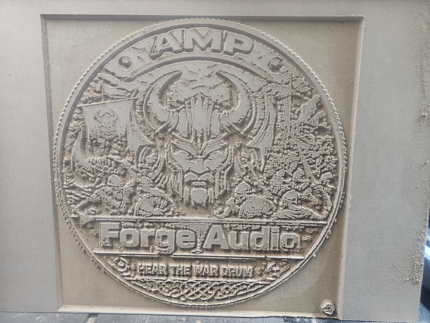 Subwoofer box panel with the Amp Forge medallion CNC-etched into it
